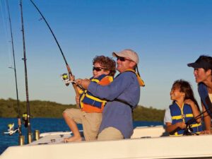 Family wearing life jackets while fishing