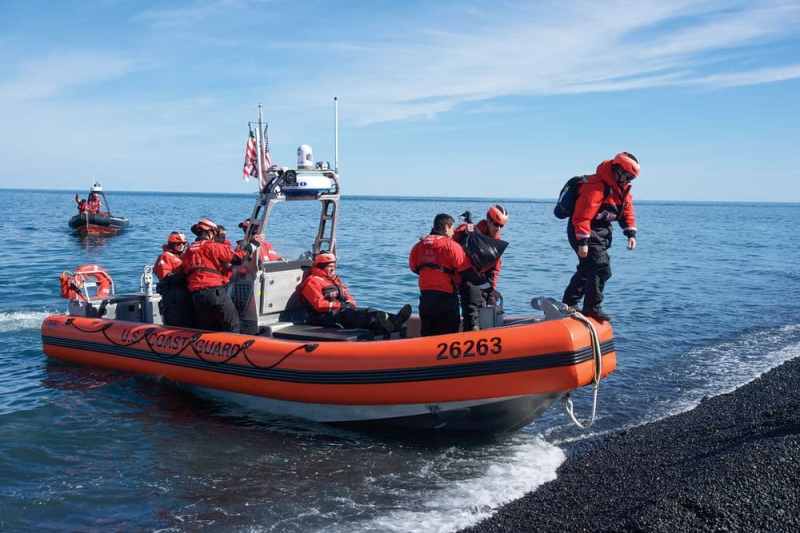btg0317_ft1_16 U.S. Coast Guard on the shore of an beach